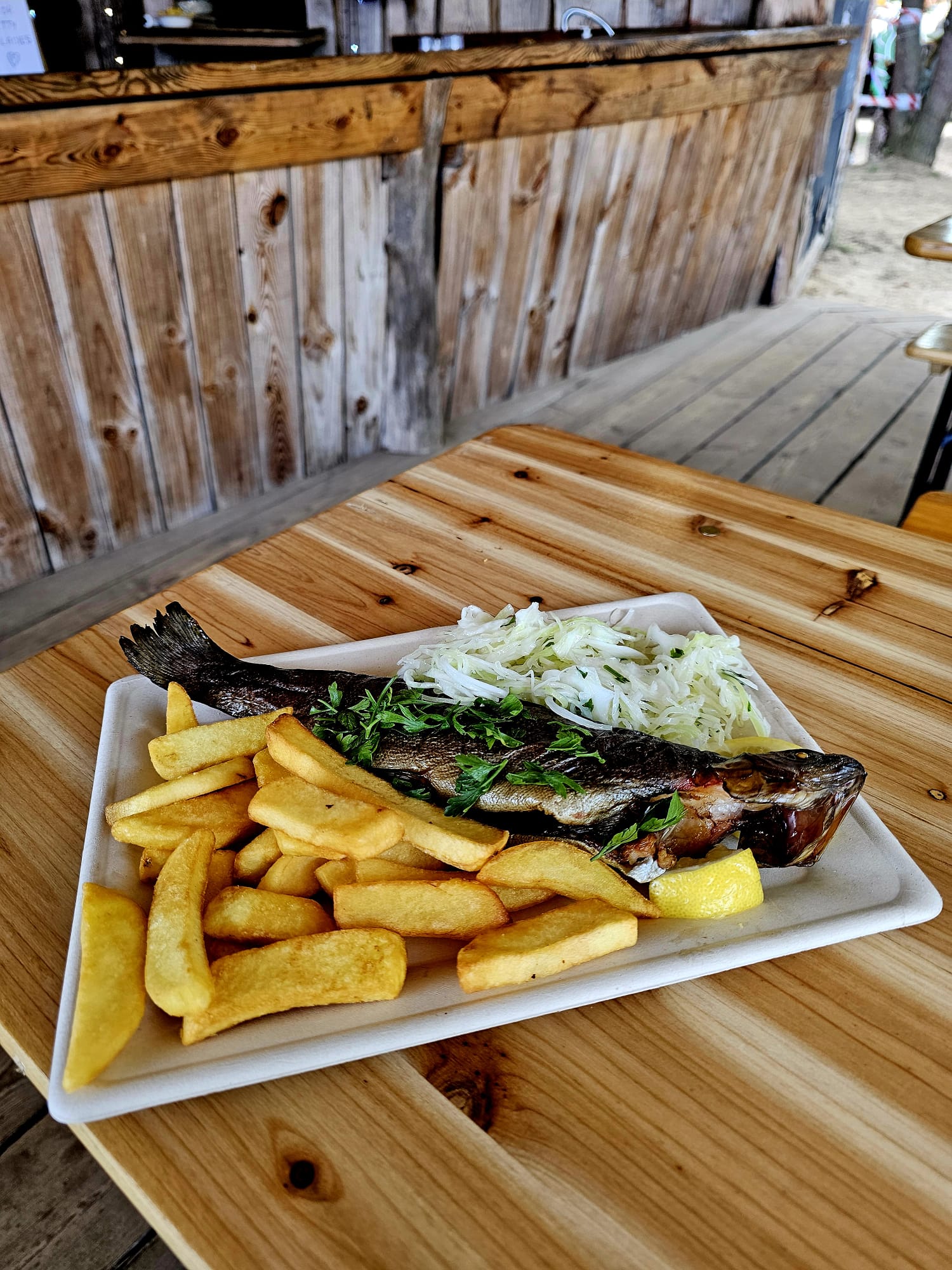 Whole trout with fries and cabbage salad served at Kuchnia Polska